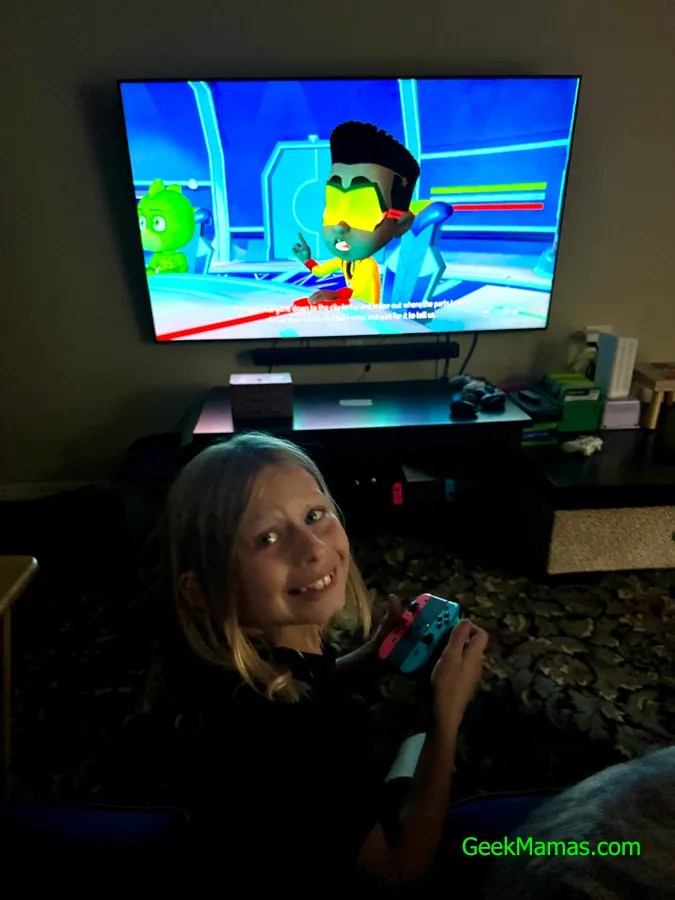 boy testing out PJ Masks Power Heroes: Mighty Alliance video game